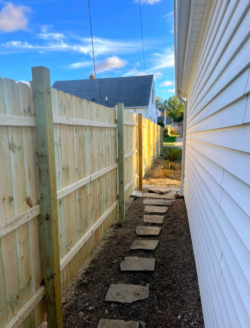 Two Dog-Eared Wood Privacy Fence Installations