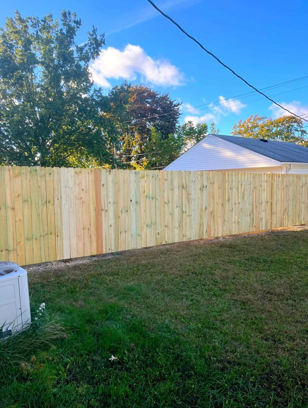 Two Dog-Eared Wood Privacy Fence Installations