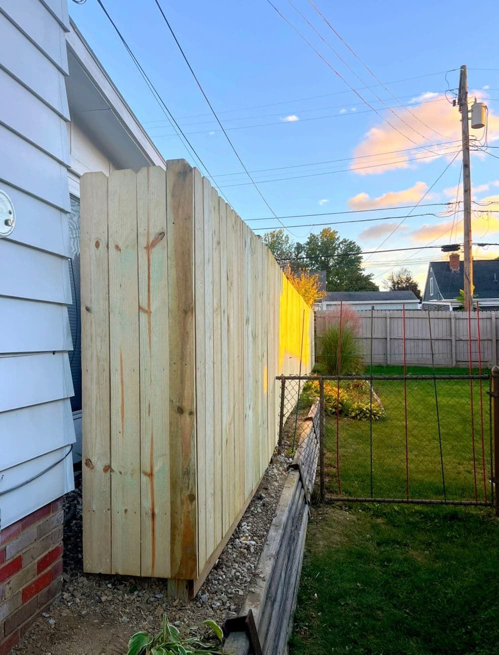 Two Dog-Eared Wood Privacy Fence Installations